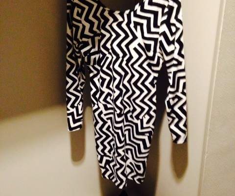 Patterned work dress with matching clutch bag and shoes